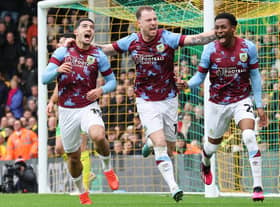 Burnley's Anass Zaroury (left) celebrates scoring the opening goal with Ashley Barnes and Nathan Tella

The EFL Sky Bet Championship - Norwich City v Burnley - Saturday 4th February 2023 - Carrow Road - Norwich