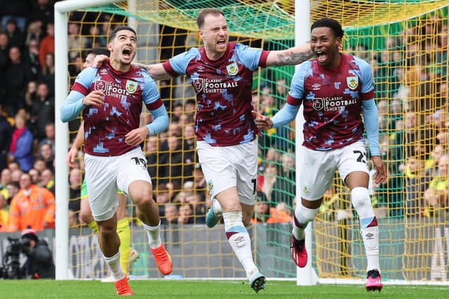 Burnley's Anass Zaroury (left) celebrates scoring the opening goal with Ashley Barnes and Nathan Tella

The EFL Sky Bet Championship - Norwich City v Burnley - Saturday 4th February 2023 - Carrow Road - Norwich
