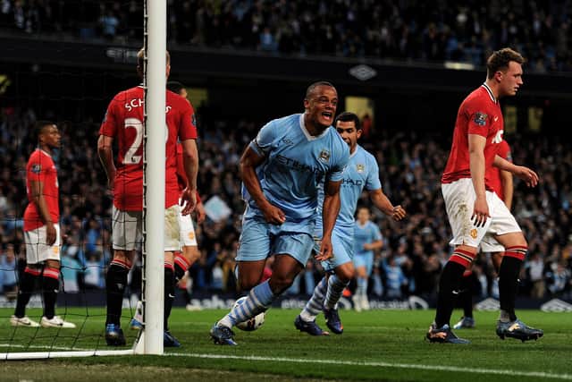 MANCHESTER, ENGLAND - APRIL 30:  Vincent Kompany of Manchester City celebrates scoring the opening goal during the Barclays Premier League match between Manchester City and Manchester United at the Etihad Stadium on April 30, 2012 in Manchester, England.  (Photo by Michael Regan/Getty Images)