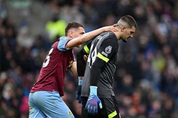 BURNLEY, ENGLAND - APRIL 13: Arijanet Muric of Burnley is consoled by his teammate Maxime Esteve after scoring an own goal during the Premier League match between Burnley FC and Brighton & Hove Albion at Turf Moor on April 13, 2024 in Burnley, England. (Photo by Gareth Copley/Getty Images) (Photo by Gareth Copley/Getty Images)