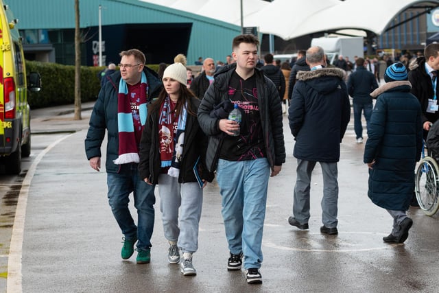 Burnley fans arrive at the Etihad Stadium ahead of their FA Cup Quarter Final fixture with Manchester City. Photo: Kelvin Stuttard
