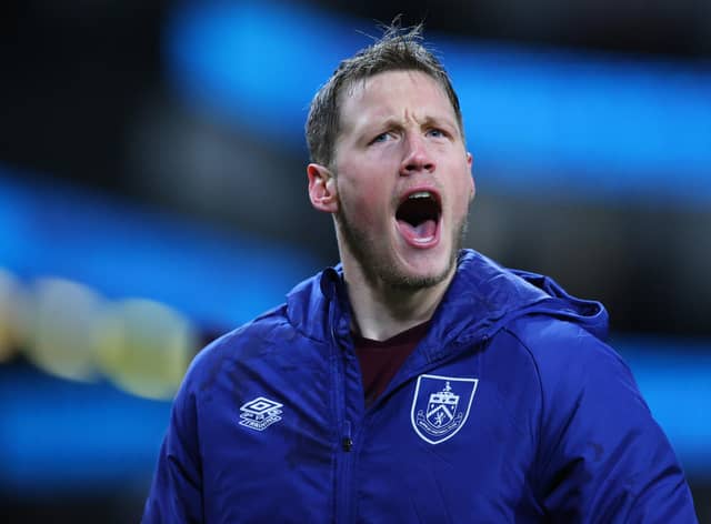 BURNLEY, ENGLAND - FEBRUARY 23: Wout Weghorst of Burnley celebrates with the fans after their sides victory during the Premier League match between Burnley and Tottenham Hotspur at Turf Moor on February 23, 2022 in Burnley, England. (Photo by Alex Livesey/Getty Images)