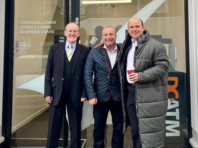 Dave Fishwick (centre) with actor Rory Kinnear (right) and David Henshaw at the Bank of Dave in Burnley