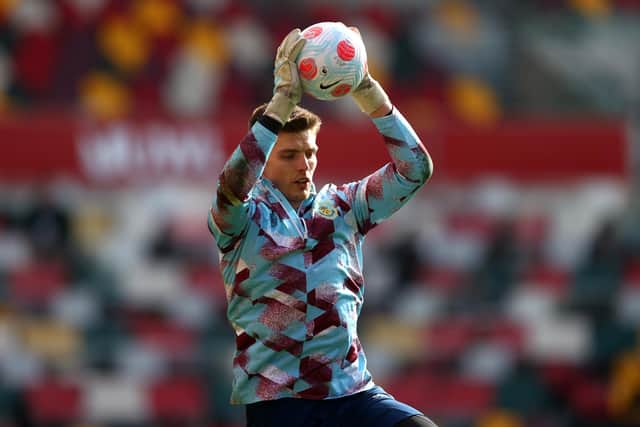 BRENTFORD, ENGLAND - MARCH 12: Nick Pope of Burnley warms up prior to the Premier League match between Brentford and Burnley at Brentford Community Stadium on March 12, 2022 in Brentford, England.