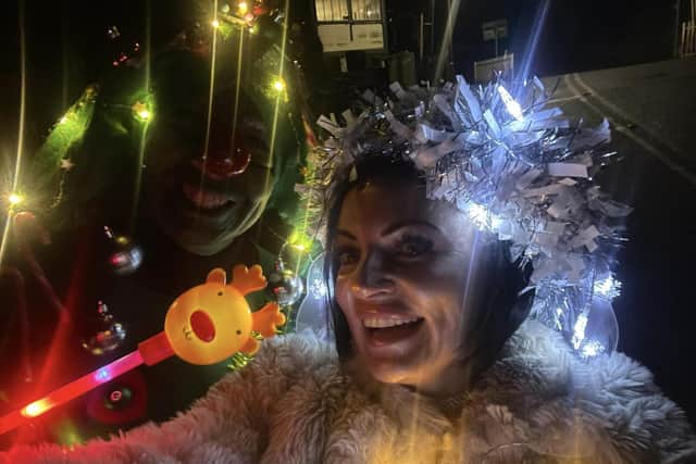 Hayley Bradshaw (right) and Marie Mason dressed in festive costumes, complete with flashing fairy lights, for their daily morning walk to raise money for Pendleside Hospice.