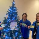 Launching the Give a Gift Appeal to buy presents for people forced to spend the festive season in hospital in East Lancashire are (left to right) Denise Gee, Head of Charity at ELHT&;Me, Demi Houghton, Digital Fundraising Officer and Rebecca Bartle, Fundraising Assistant