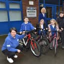 (Adults) L – Michelle Grimes, Project Lead at Active Cycles, C – Dr Amanda Thornton, Active Lancashire Board Lead for Health and Wellbeing, R – Mr Clough, Sports Coach at Brunshaw Primary School with students and their donated bikes from Active Seconds.