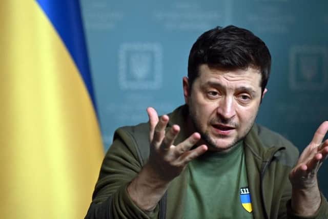 Ukrainian President Volodymyr Zelensky speaks during a press conference in Kyiv on March 3, 2022 (Photo by SERGEI SUPINSKY/AFP via Getty Images)