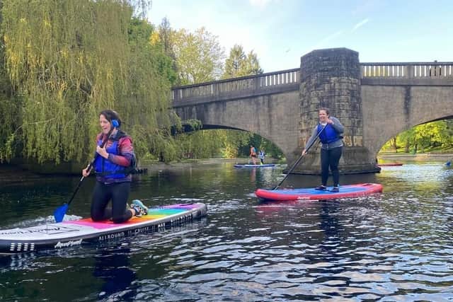 Dany (front) has fun on her very first paddleboarding lesson in Burnley's Thompson Park