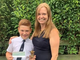 Enterprising George Greenwood, a year six pupil at St Leonard's C of E School in Langho, raised £233 for UNICEF all on his own. He is pictured here with his proud headteacher Dawn Lindley.