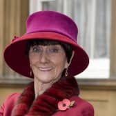 June Brown stands outside Buckingham Palace in London after receiving an MBE for services to Drama and Charity from Queen Elizabeth II.