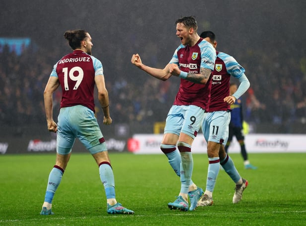 BURNLEY, ENGLAND - FEBRUARY 08: Jay Rodriguez of Burnley is congratulated by Wout Weghorst and Dwight McNeil of Burnley after scoring their side's first goal during the Premier League match between Burnley and Manchester United at Turf Moor on February 08, 2022 in Burnley, England. (Photo by Clive Brunskill/Getty Images)