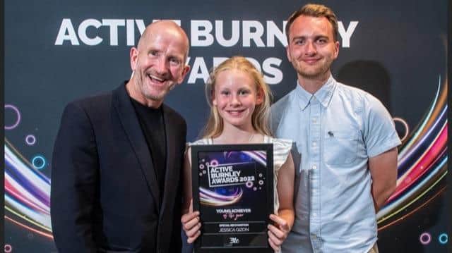 Sports superstar Jessica Gizon, one of the youngest nominees at the Active Burnley awards with star guest Eddie 'the eagle' Edwards and her sports teacher Mr Joe O'Brien who nominated her