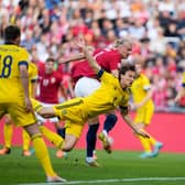 Norway's forward Erling Braut Haaland (C) gets to the ball ahead of Sweden's defender Hjalmar Ekdal to score the opening goal during the UEFA Nations League football match Norway v Sweden in Oslo, Norway, on June 12, 2022. - - Norway OUT (Photo by Javad Parsa / NTB / AFP) / Norway OUT (Photo by JAVAD PARSA/NTB/AFP via Getty Images)