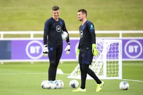 BURTON-UPON-TRENT, ENGLAND - SEPTEMBER 02: Tom Heaton and Nick Pope share a joke  during an England Media Access day at St Georges Park on September 02, 2019 in Burton-upon-Trent, England. (Photo by Michael Regan/Getty Images)
