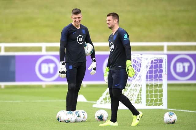 BURTON-UPON-TRENT, ENGLAND - SEPTEMBER 02: Tom Heaton and Nick Pope share a joke  during an England Media Access day at St Georges Park on September 02, 2019 in Burton-upon-Trent, England. (Photo by Michael Regan/Getty Images)