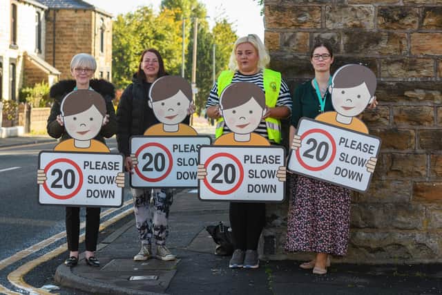 Pictured with the 'slow down' sign are (left to right) Coun. Lorraine Mehanna, Kathryn Sattar and Sophie Stanworth, volunteers from Rosegrove Neighbourhood Watch and Coun. Gail Barton.