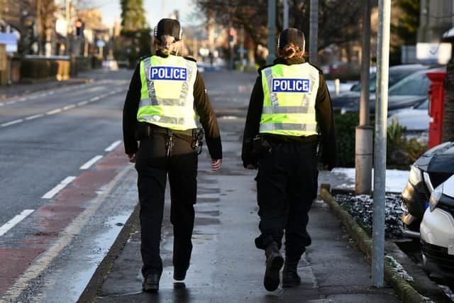 Two police officers on foot patrol. Picture by Michael Gillen.