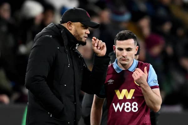 BURNLEY, ENGLAND - JANUARY 12: Vincent Kompany, Manager of Burnley, speaks with Josh Cullen of Burnley during the Premier League match between Burnley FC and Luton Town at Turf Moor on January 12, 2024 in Burnley, England. (Photo by Gareth Copley/Getty Images)