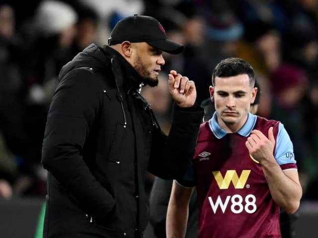 BURNLEY, ENGLAND - JANUARY 12: Vincent Kompany, Manager of Burnley, speaks with Josh Cullen of Burnley during the Premier League match between Burnley FC and Luton Town at Turf Moor on January 12, 2024 in Burnley, England. (Photo by Gareth Copley/Getty Images)