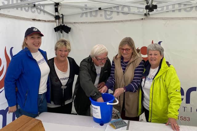 Helping  to create a  bean feast for Rosemere Cancer Foundation as food festival visitors support its fundraising raffle and tombola run by volunteers ( left to right_
Louise Grant, Norma Blackburn, Roger Wilson, Sandra Varnavas and Margaret Dunn