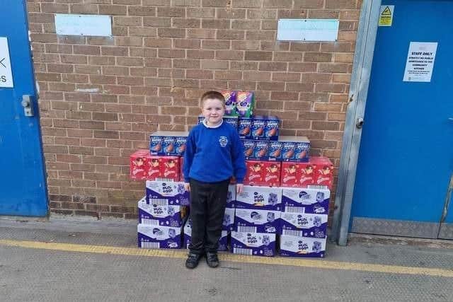 Alfie Smith with the 200 Easter eggs he donated to Burnley Community Kitchen after his amazing fund raising efforts