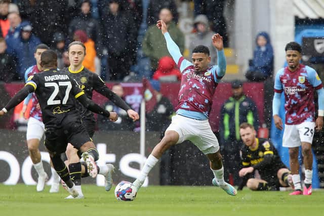 Wigan Athletic's Tendayi Darikwa battles for possession with Burnley's Lyle Foster

The EFL Sky Bet Championship - Burnley v Wigan Athletic - Saturday 11th March 2023 - Turf Moor - Burnley