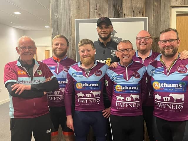 The riders and driver Graham Rushton pictured with Vincent Kompany at Burnley's Gawthorpe training ground. Submitted picture.