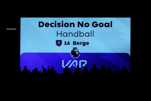 NOTTINGHAM, ENGLAND - SEPTEMBER 18: The LED screen displays the VAR decision of 'No Goal - Handball' for the goal scored by Lyle Foster of Burnley (not pictured) during the Premier League match between Nottingham Forest and Burnley FC at City Ground on September 18, 2023 in Nottingham, England. (Photo by Marc Atkins/Getty Images)