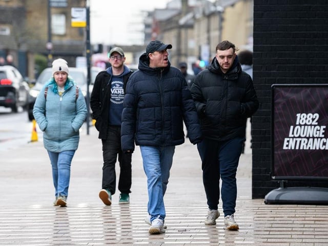 Burnley fans arrive at Turf Moor for the Premier League fixture against West Ham United. Photo: Kelvin Lister-Stuttard