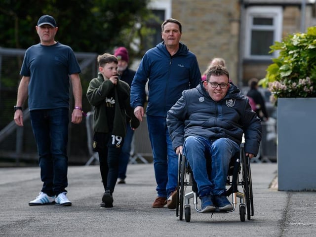 Burnley fans arrive at Turf Moor for the Premier League fixture against Brighton and Hove Albion. Photo: Kelvin Lister-Stuttard