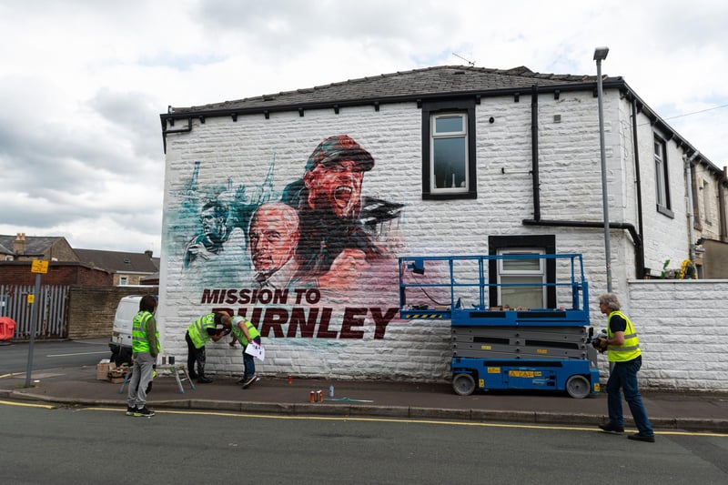 Mission to Burnley mural being painted on the side of a house on Higgin Street opposite Turf Moor. Photo: Kelvin Lister-Stuttard