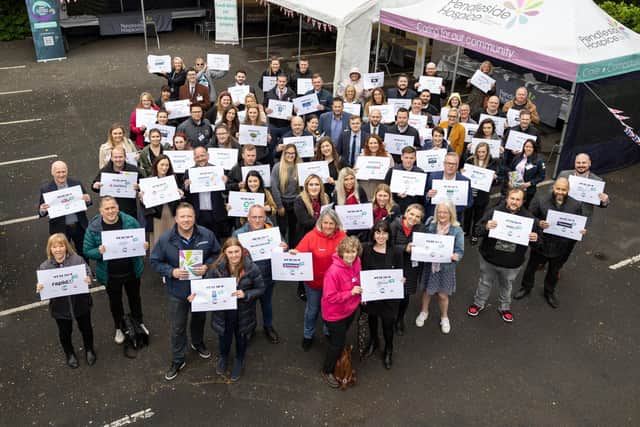 Representatives from 59 businesses cheer the launch of the Pendleside Corporate Challenge 2022.