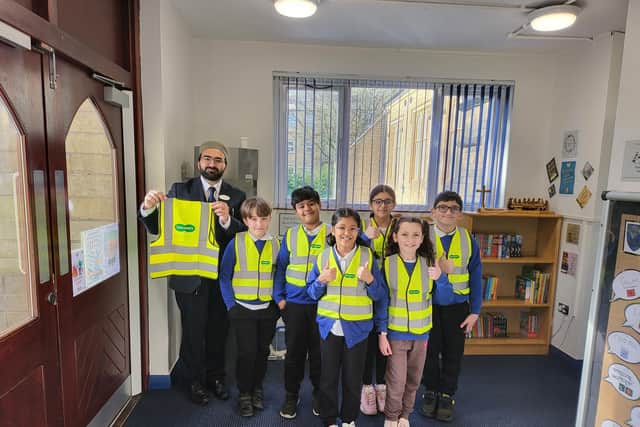 Specsavers in Burnley have donated a selection of hi vis jackets to St Peter's C of E Primary School in Burnley