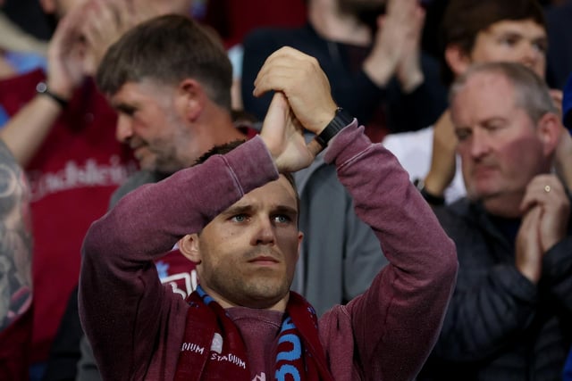 A fan applauding his team.
