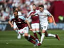 LONDON, ENGLAND - APRIL 17: Ashley Westwood of Burnley is challenged by Tomas Soucek of West Ham United during the Premier League match between West Ham United and Burnley at London Stadium on April 17, 2022 in London, England. (Photo by Steve Bardens/Getty Images)