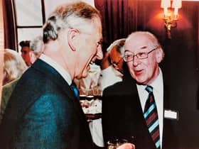 King Charles III, then the Prince of Wales, meeting former Burnley Football Club director John Sullivan at Holyrood House in Edinburgh