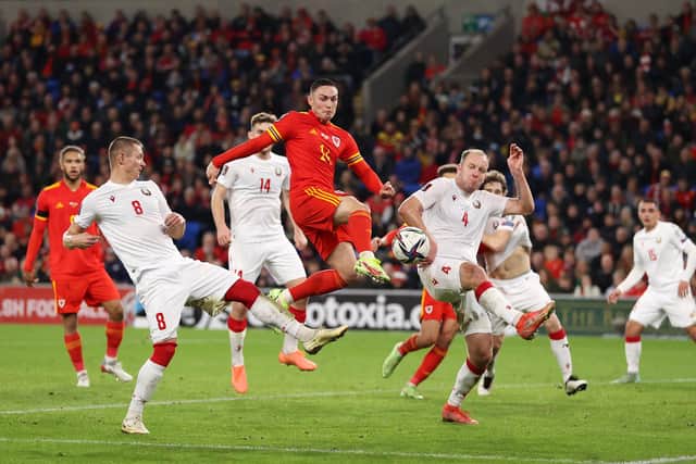 CARDIFF, WALES - NOVEMBER 13: Connor Roberts of Wales scores their side's fifth goal during the 2022 FIFA World Cup Qualifier match between Wales and Belarus at Cardiff City Stadium on November 13, 2021 in Cardiff, Wales.