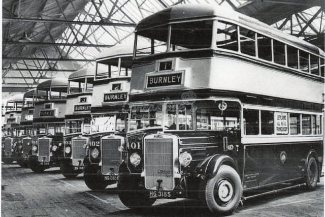 These are Leyland TD4C buses 32 of which were purchased to replace trams when the town’s tram system was closed in 1935. They are photographed in Leyland, Lancashire, before their departure for Burnley