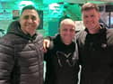 All smiles for DJ Carl Andrew (centre) after completing a 48 hour on stop music gig with Remedy owner Madge Nawaz (left) and friend Joe Traff