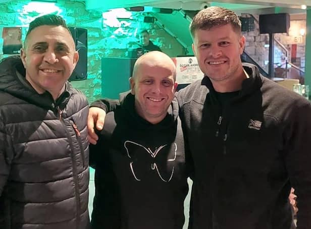 All smiles for DJ Carl Andrew (centre) after completing a 48 hour on stop music gig with Remedy owner Madge Nawaz (left) and friend Joe Traff