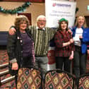 A49 friendship club founder Christine Snape (far left) and fellow “friends” as club members are known (left to right), Roger Wilson, Jenny Bank and Pam Hargreaves present Rosemere Cancer Foundation volunteer Louise Grant (second from the right) with their donation raised by gifting a prize for a fundraising raffle rather than sending Christmas cards to each other