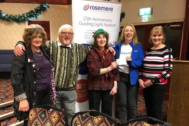 A49 friendship club founder Christine Snape (far left) and fellow “friends” as club members are known (left to right), Roger Wilson, Jenny Bank and Pam Hargreaves present Rosemere Cancer Foundation volunteer Louise Grant (second from the right) with their donation raised by gifting a prize for a fundraising raffle rather than sending Christmas cards to each other