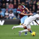 BURNLEY, ENGLAND - NOVEMBER 25: Danny Ings of West Ham United is challenged by Sander Berge of Burnley during the Premier League match between Burnley FC and West Ham United at Turf Moor on November 25, 2023 in Burnley, England. (Photo by Matt McNulty/Getty Images)