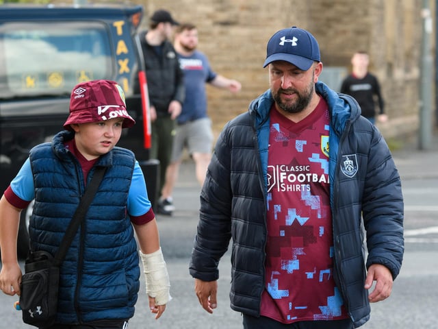 Burnley fans arrive at Turf Moor ahead of the Lancashire Derby with Blackpool. Photo: Kelvin Stuttard