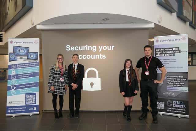 Laura Nolan and PC Charlie Bamber of Lancashire Constabulary with pupils at Shuttleworth College in Padiham during online safety sessions.