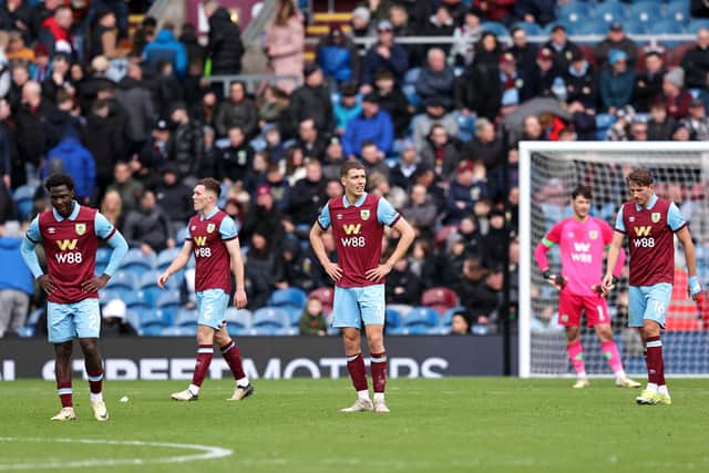 BURNLEY, ENGLAND - MARCH 03: Players of Burnley look dejected after Antoine Semenyo of AFC Bournemouth (not pictured) scores his team's second goal during the Premier League match between Burnley FC and AFC Bournemouth at Turf Moor on March 03, 2024 in Burnley, England. (Photo by Matt McNulty/Getty Images)