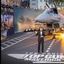 Hollywood legend Tom Cruise poses with a full sized replica of BAE Systems Typhoon at the premier of Top Gun Maverick in London