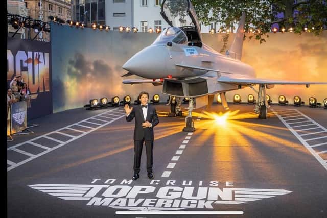 Hollywood legend Tom Cruise poses with a full sized replica of BAE Systems Typhoon at the premier of Top Gun Maverick in London