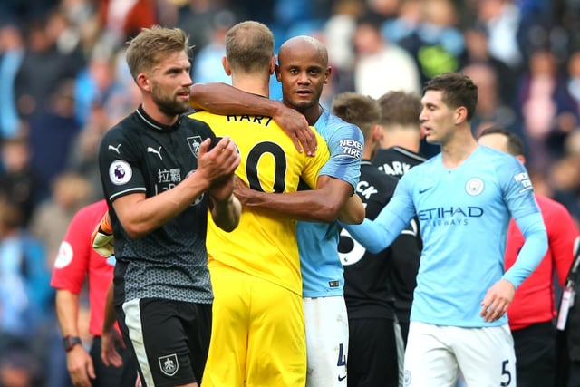MANCHESTER, ENGLAND - OCTOBER 20: Vincent Kompany of Manchester City and Joe Hart of Burnley embrace after the Premier League match between Manchester City and Burnley FC at Etihad Stadium on October 20, 2018 in Manchester, United Kingdom.  (Photo by Alex Livesey/Getty Images)